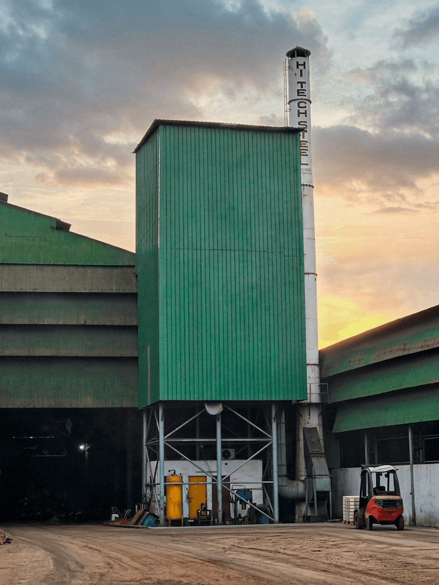 Hi-Tech Steel factory chimney at dusk